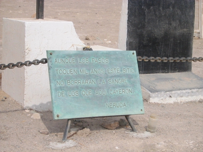 “Even though footsteps touch this site for a thousand years, they will not erase the blood of those who fell here.” The opening lines of “Siempre,” one of the poems from Pablo Neruda’s Canto General, which appear on a plaque before an excavated mass grave in Pisagua. photo © Lorraine Caputo 