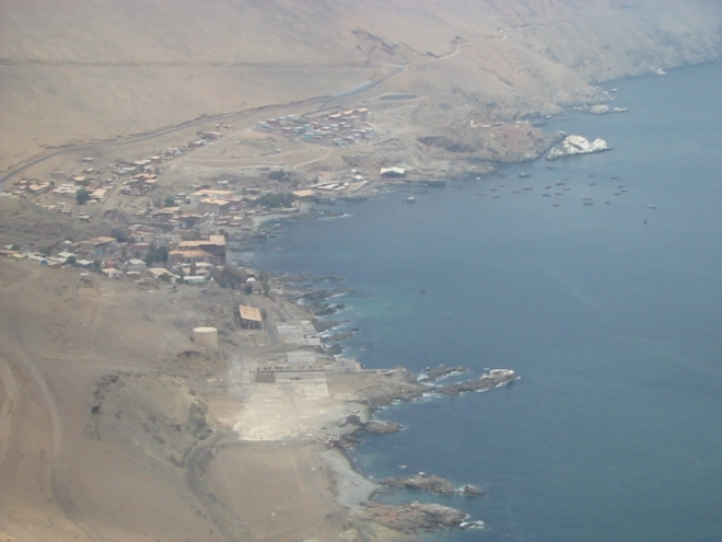Pisagua, as seen from the heights, descending from the Atacama Desert’s pampas to the sea. photo © Lorraine Caputo 